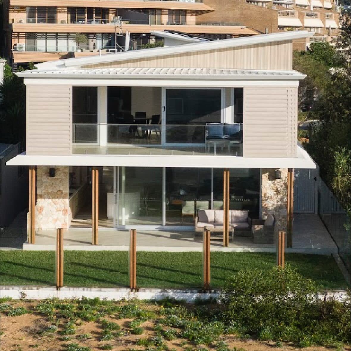 Rear elevation from above — the finished beachfront build