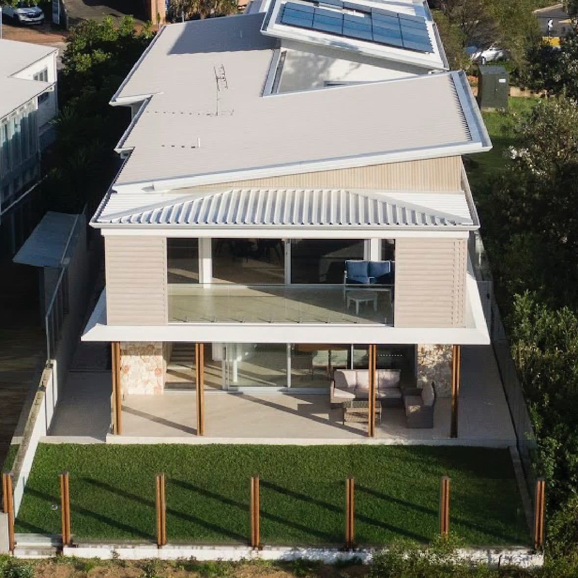 The house from the beach side in afternoon light