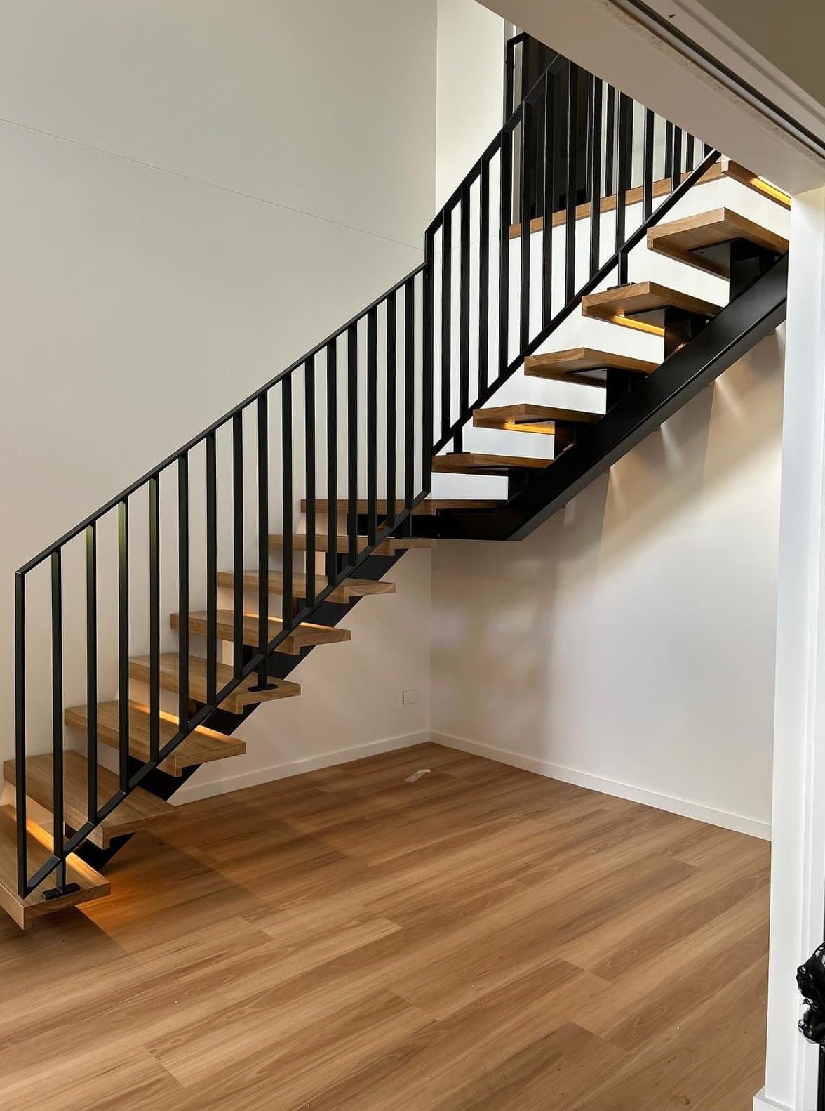 Under-stair view showing the single stringer line