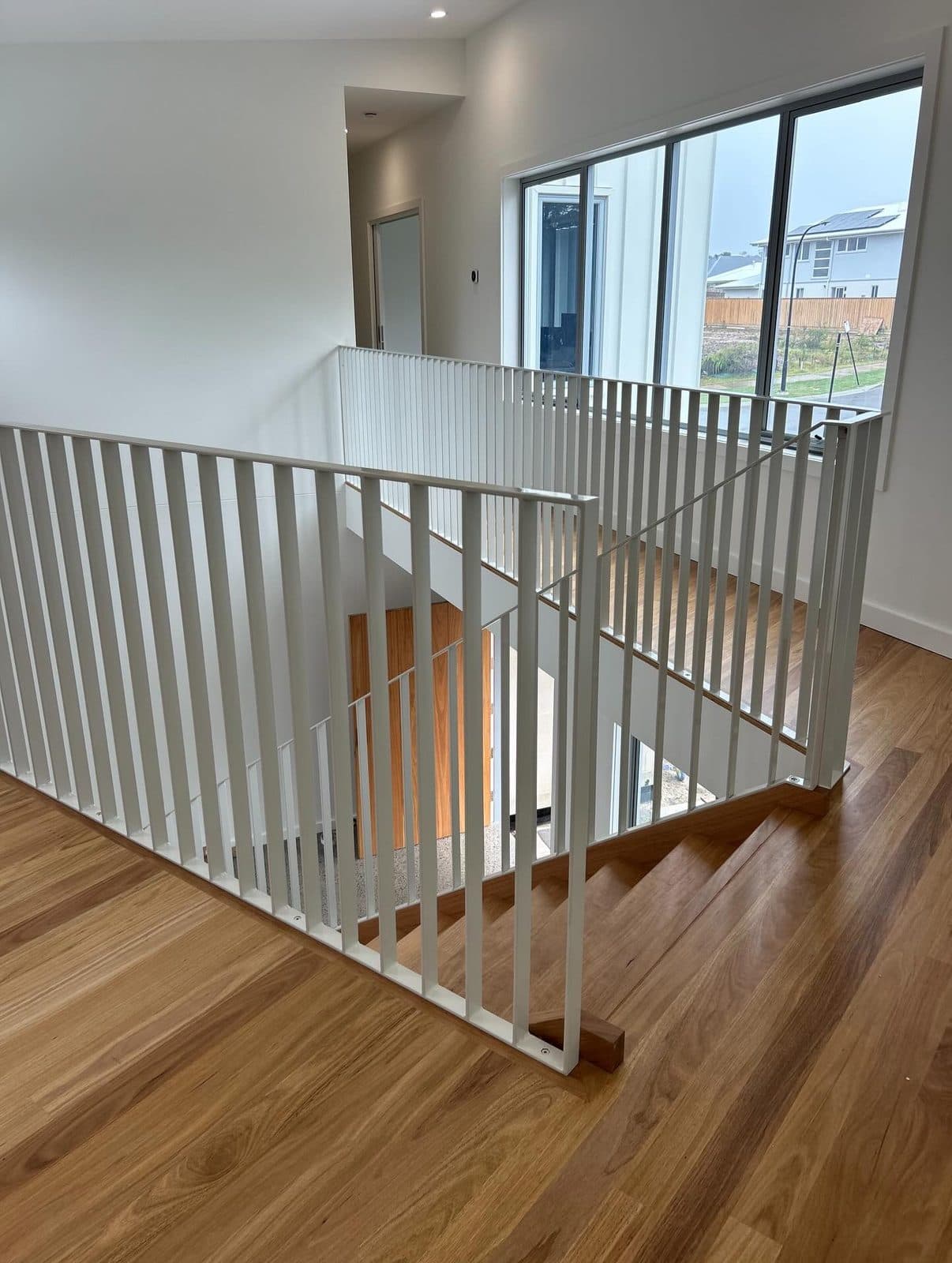 White balustrade wrapping the stair void