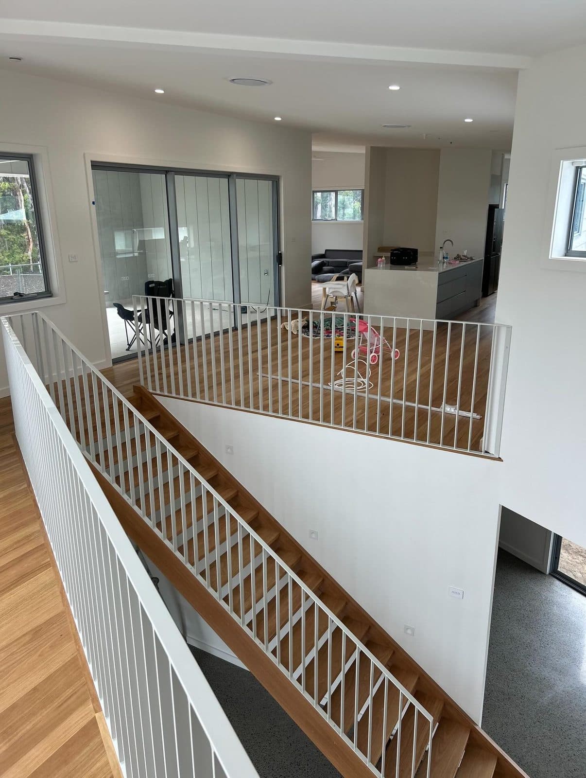 Balustrade over the void with the living space below