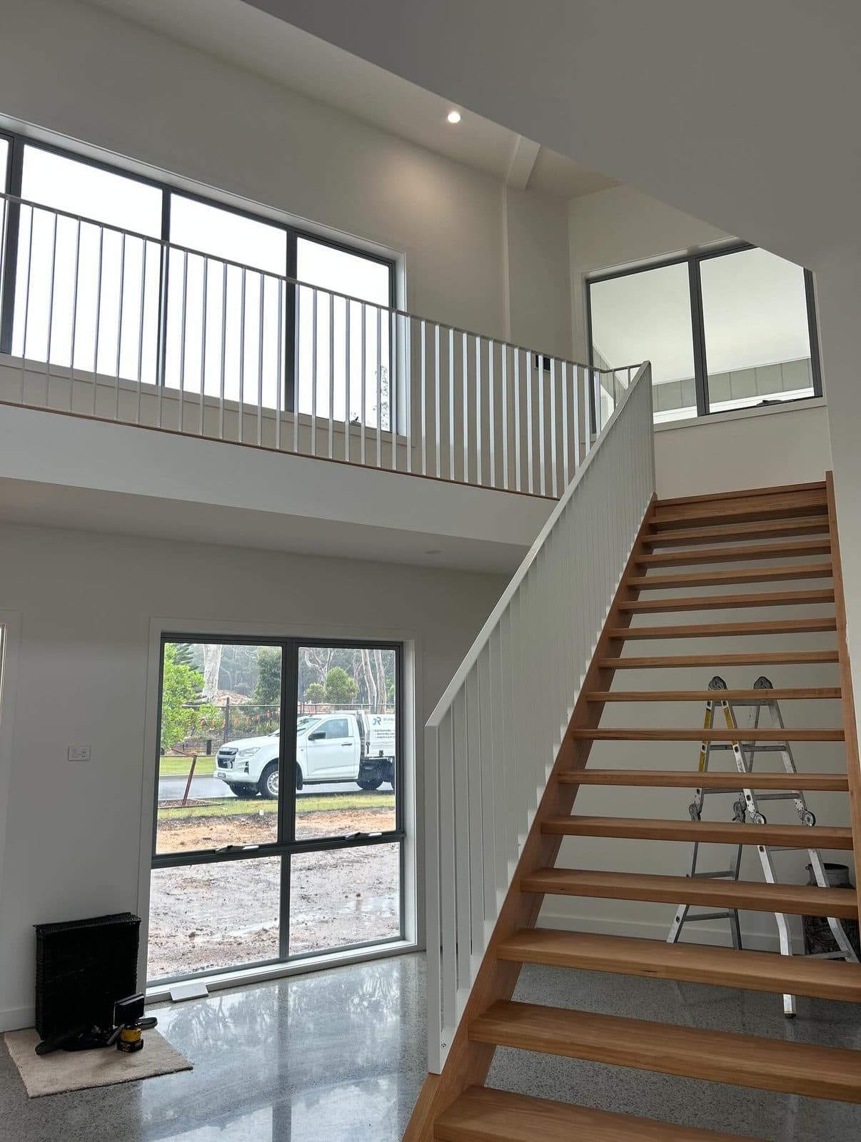 The stair with timber treads and white balustrade