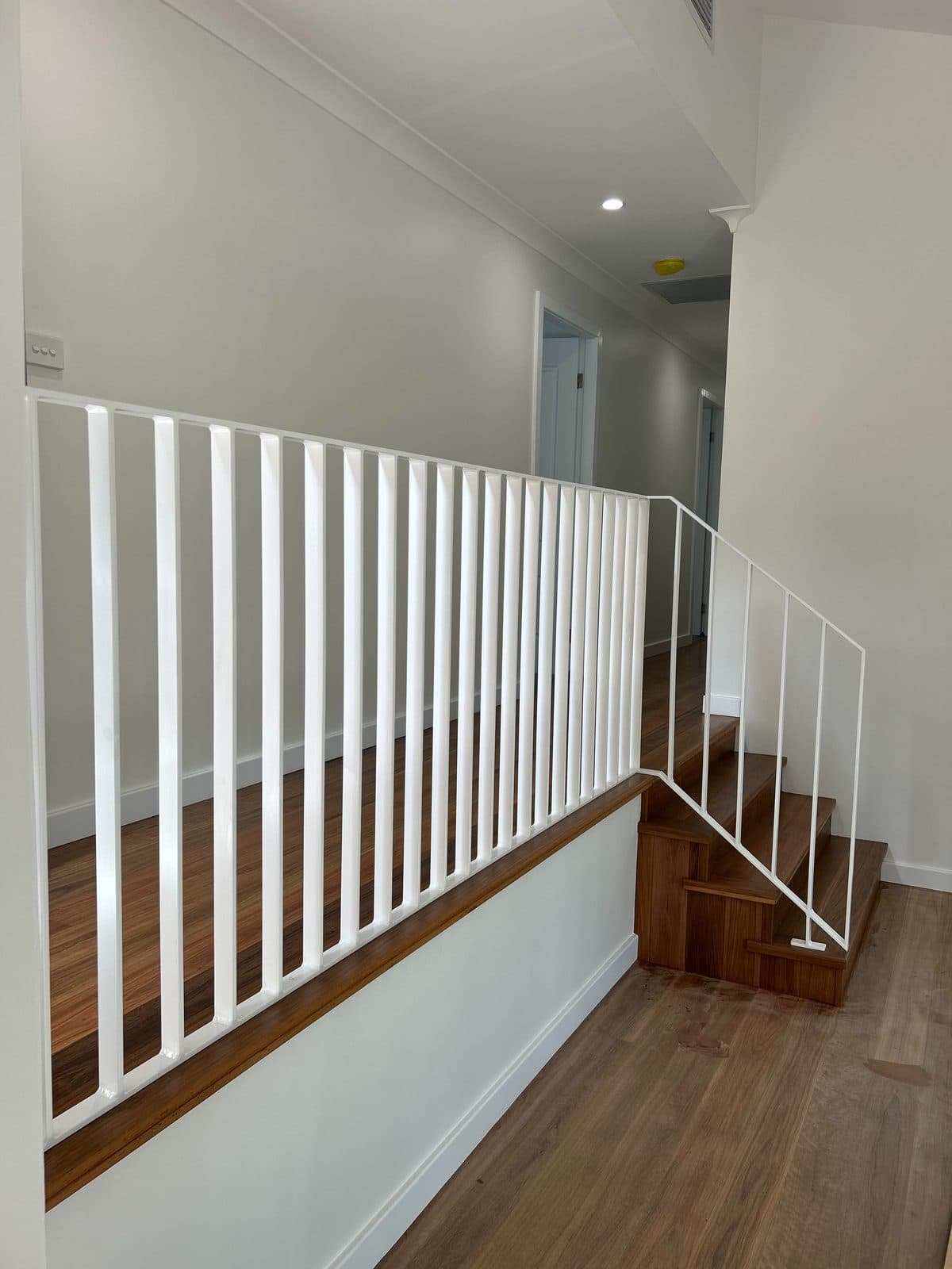 The balustrade run along the hallway split level