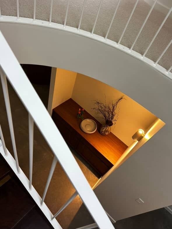 Looking down the curved stairwell