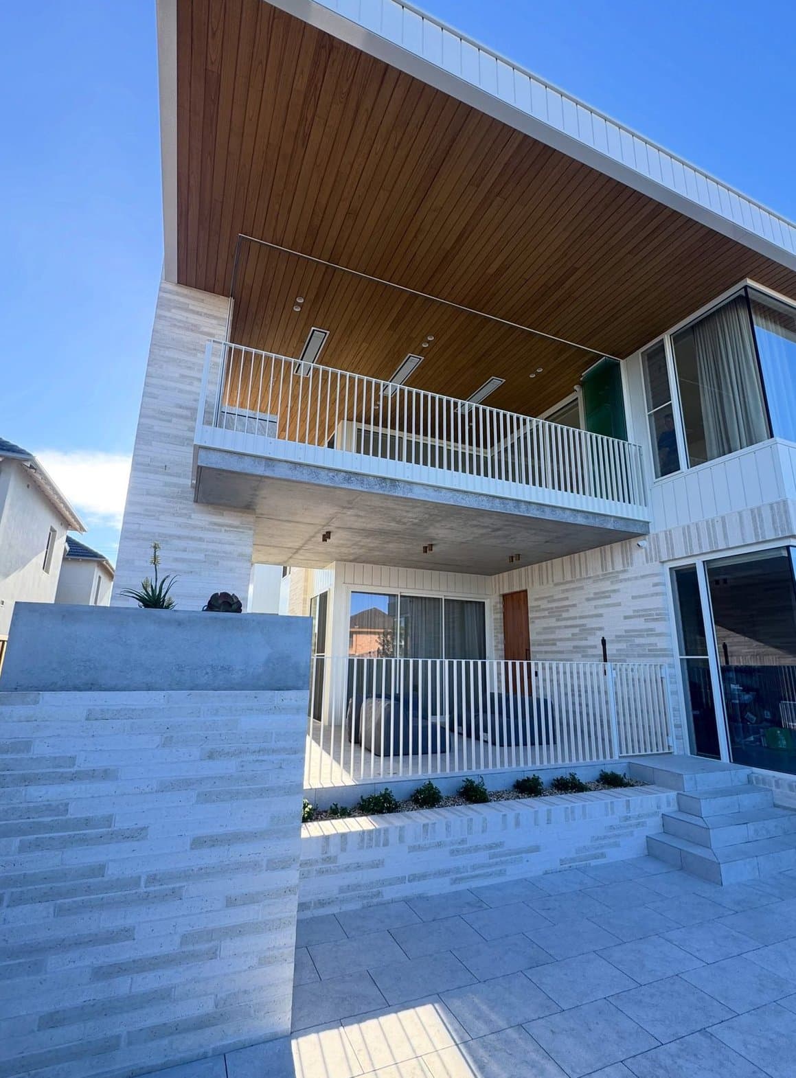 Courtyard elevation — hoods, balustrade and screens together