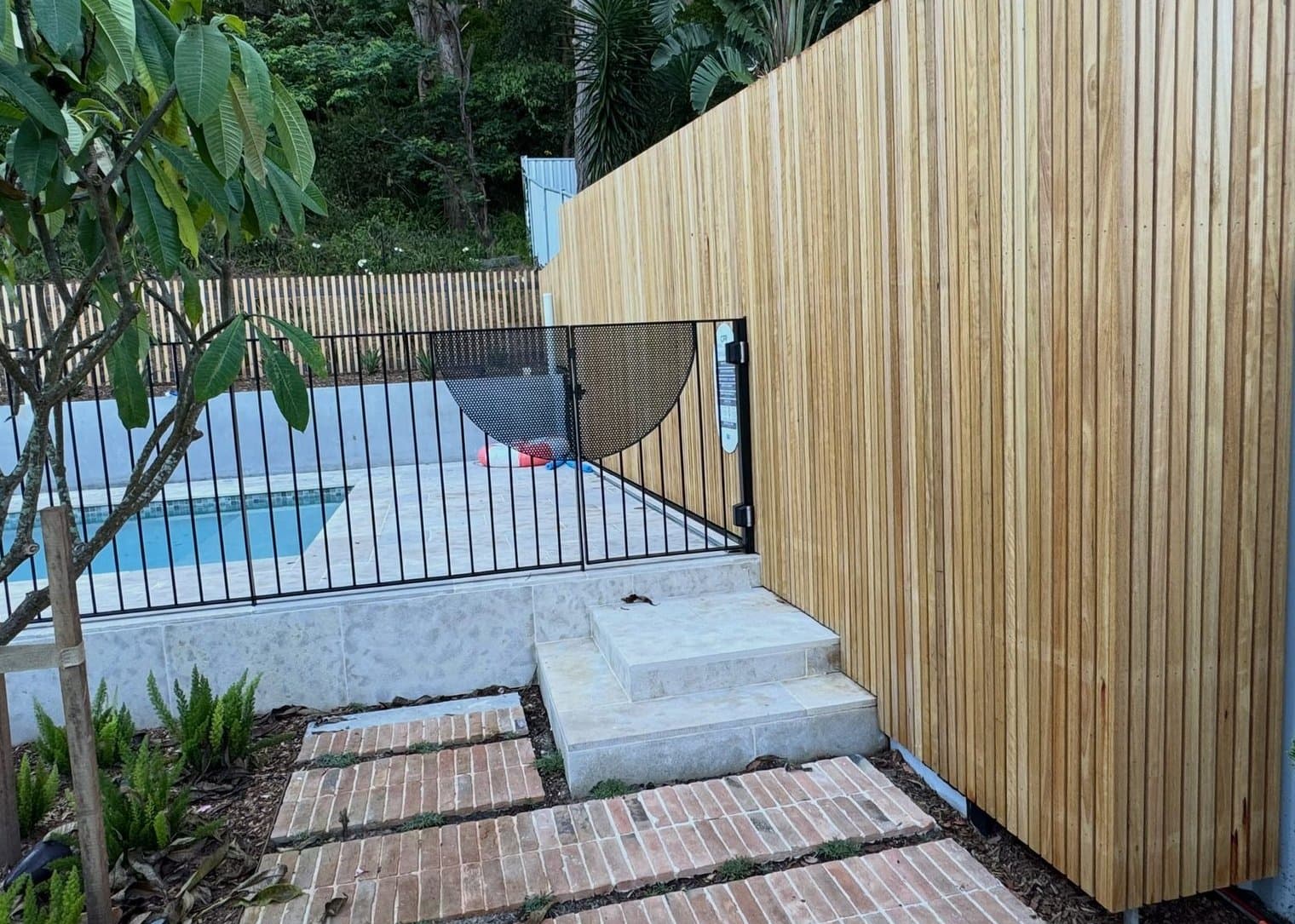 Gate detail by the paved steps